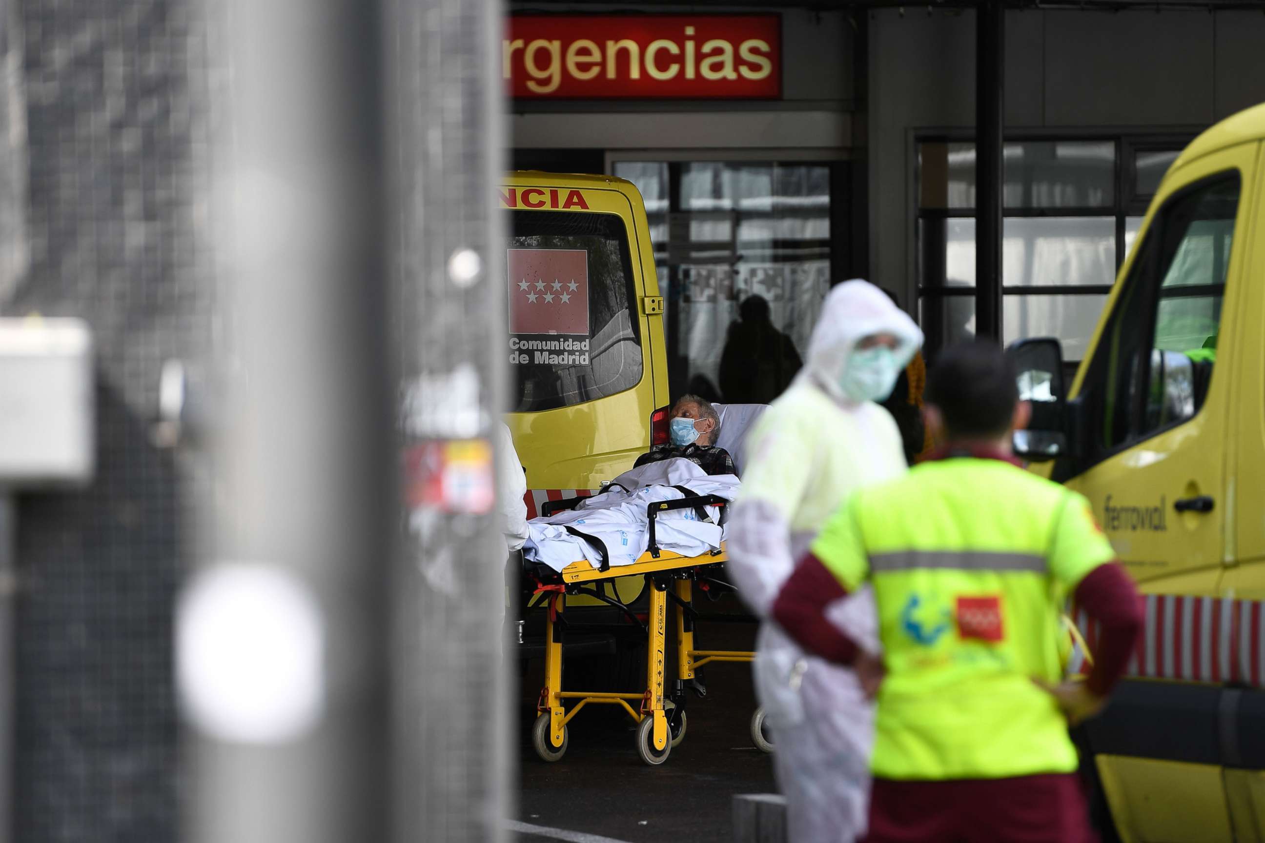 PHOTO: A man wearing a face mask is wheeled into La Paz hospital in Madrid, March 23, 2020, amid a national lockdown to fight the spread of the coronavirus. 