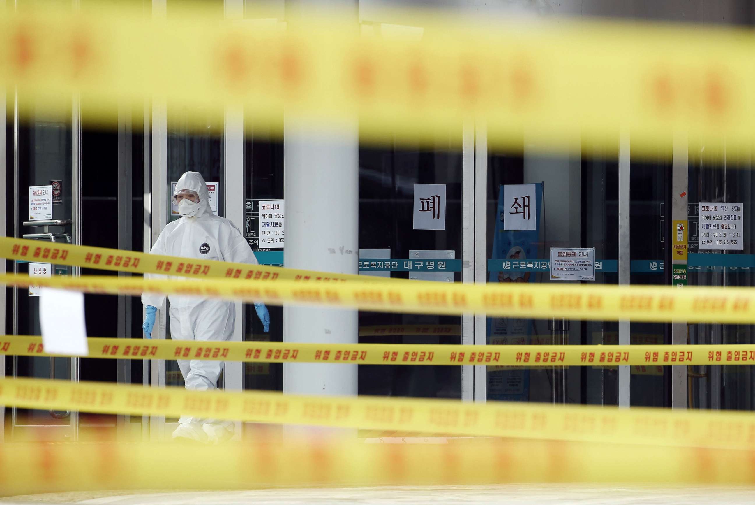 PHOTO: A medical staff member wears protective gear inside the yellow control lines at a hospital for patients infected with coronavirus in Daegu, South Korea, March 1, 2020. 