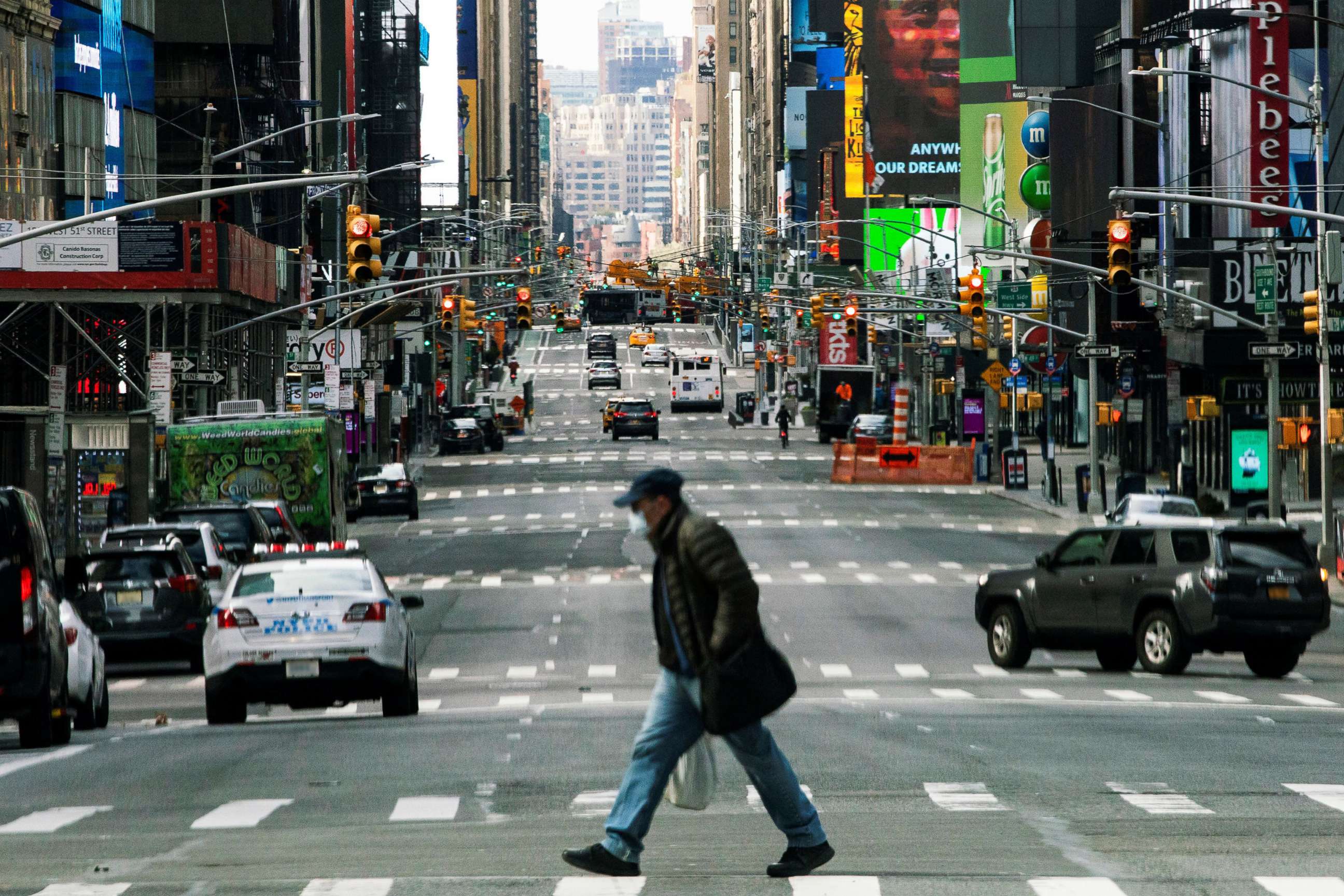 PHOTO: People walk around Times Square as the coronavirus disease (COVID-19) outbreak continues in New York, March 22, 2020.  