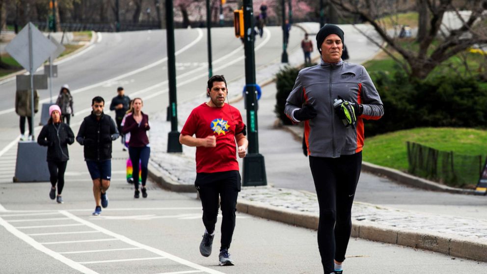 PHOTO: People exercise at Central Park as the coronavirus outbreak continues in New York, March 22, 2020.  