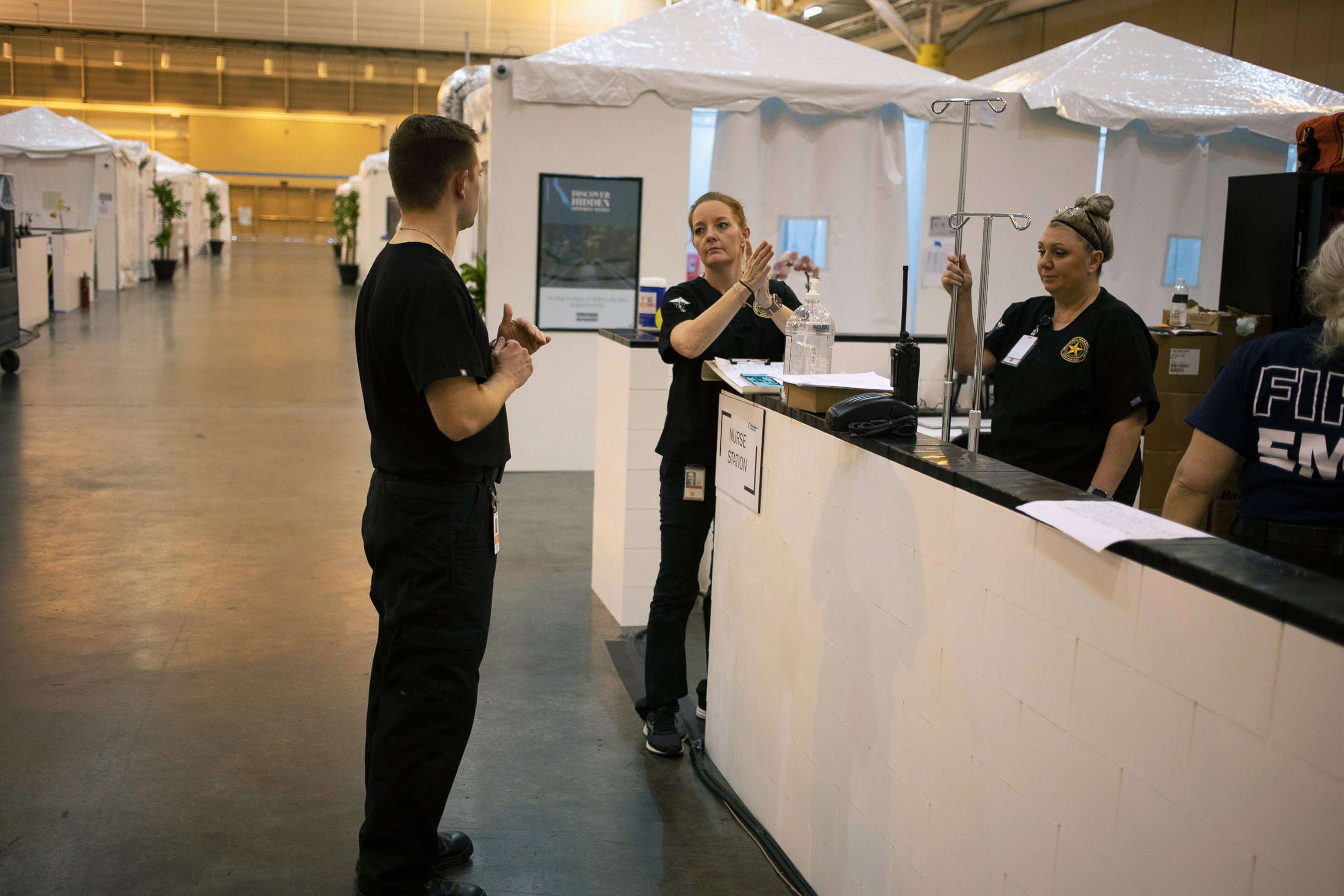 PHOTO: Staff stand at a nurse station inside the Ernest N. Morial Convention Center as they prepare for coronavirus disease (COVID-19) patients in New Orleans, April 5, 2020. 