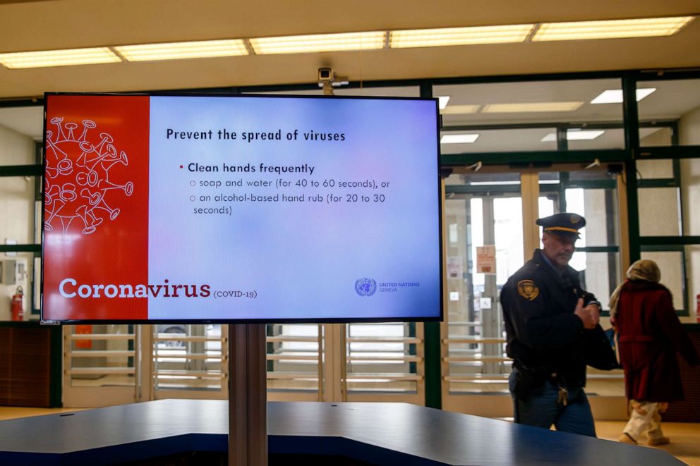 PHOTO: Information regarding the novel coronavirus are displayed on a screen at the European headquarters of the United Nations in Geneva, Switzerland, on March 4, 2020.