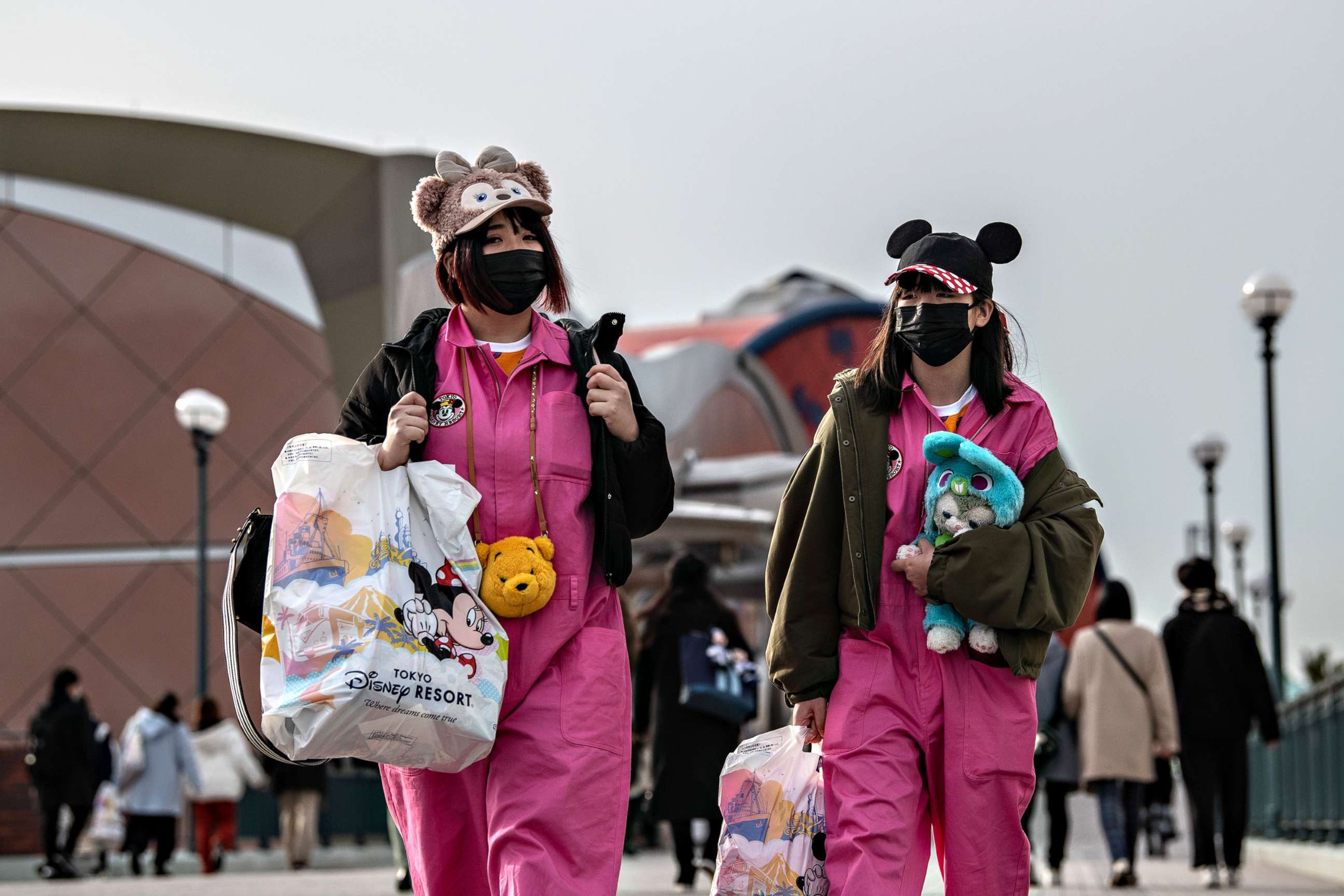 PHOTO: Two women leave Tokyo Disneyland on the day it announced it will close until March 15th because of concerns over the COVID-19 virus, on Feb. 28, 2020 in Japan. 
