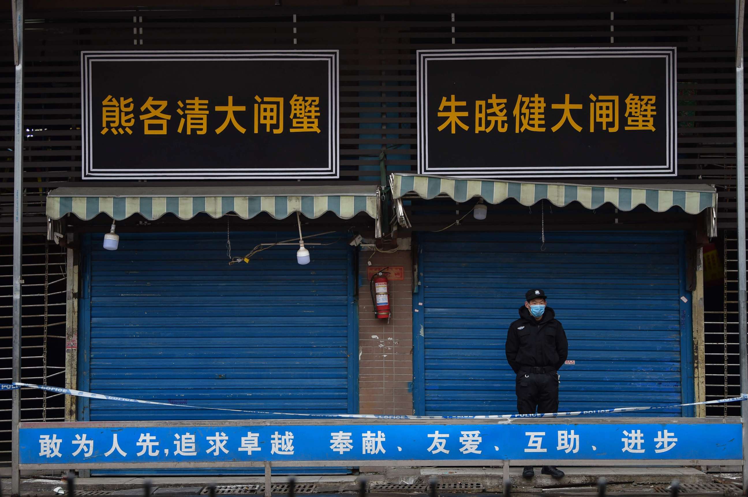 PHOTO: A security guard stands outside the Huanan Seafood Wholesale Market where the coronavirus was detected in Wuhan, China, on Jan. 24, 2020.