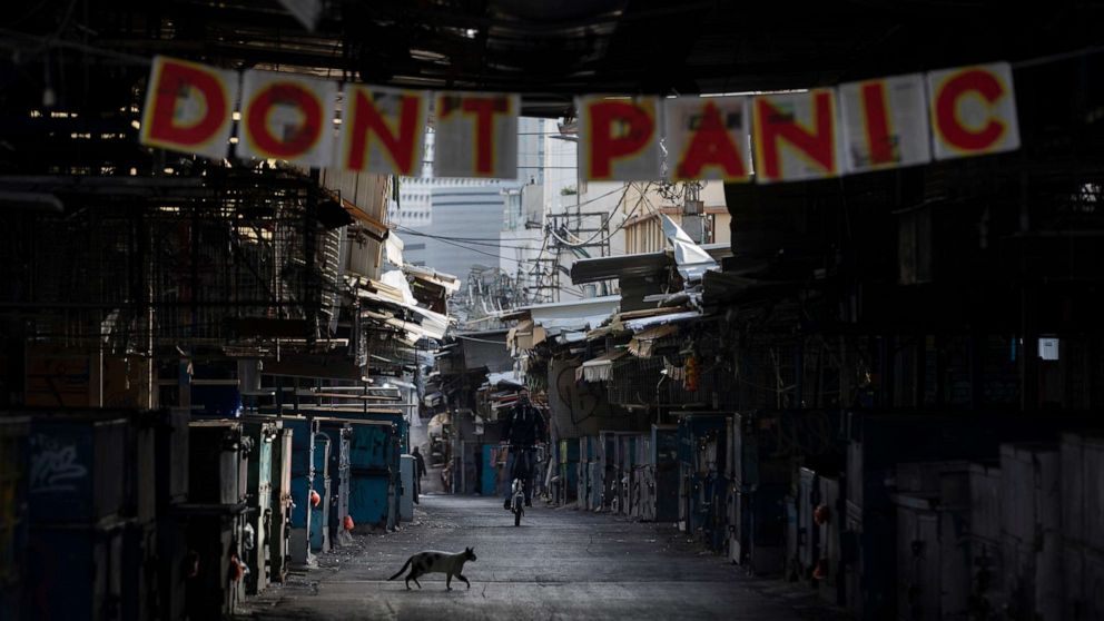 PHOTO: A "don't panic" sign hang on the entrance of a closed food market that was shut down in order to reduce the spread of the coronavirus, in Tel Aviv, Israel, March 23, 2020.