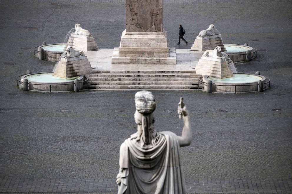 PHOTO: A view of the empty Piazza del Popolo square during the emergency blockade of Coronavirus in Rome, March 17, 2020. Italy now has more than 27,000 covid-19 cases, 2,158 are dead and 2,749 are recovered.