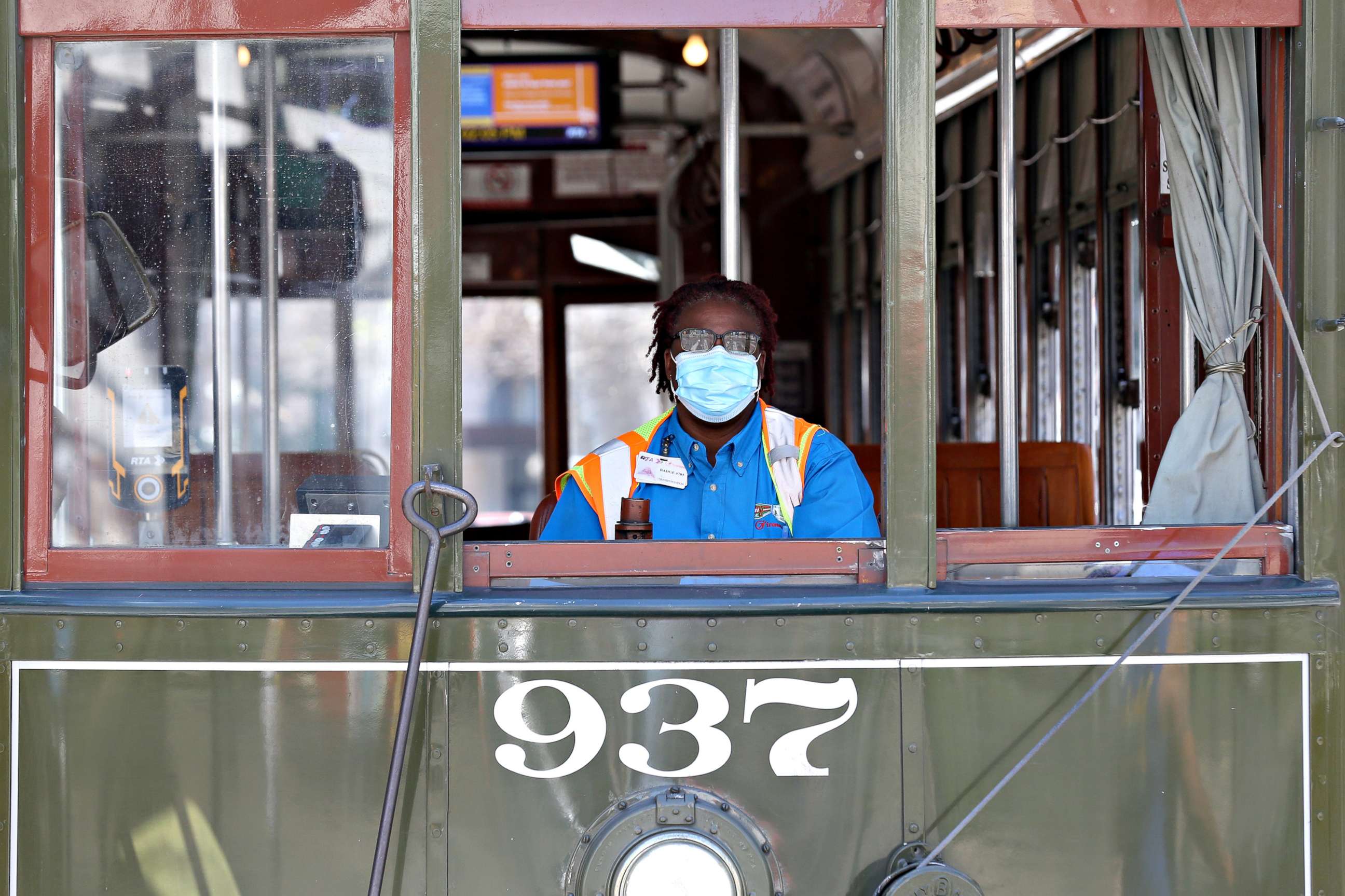 PHOTO: A streetcar driver wears a mask amid the coronavirus outbreak, in New Orleans, March 25, 2020. 