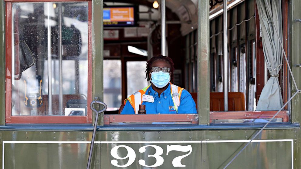 PHOTO: A streetcar driver wears a mask amid the coronavirus outbreak, in New Orleans, March 25, 2020. 