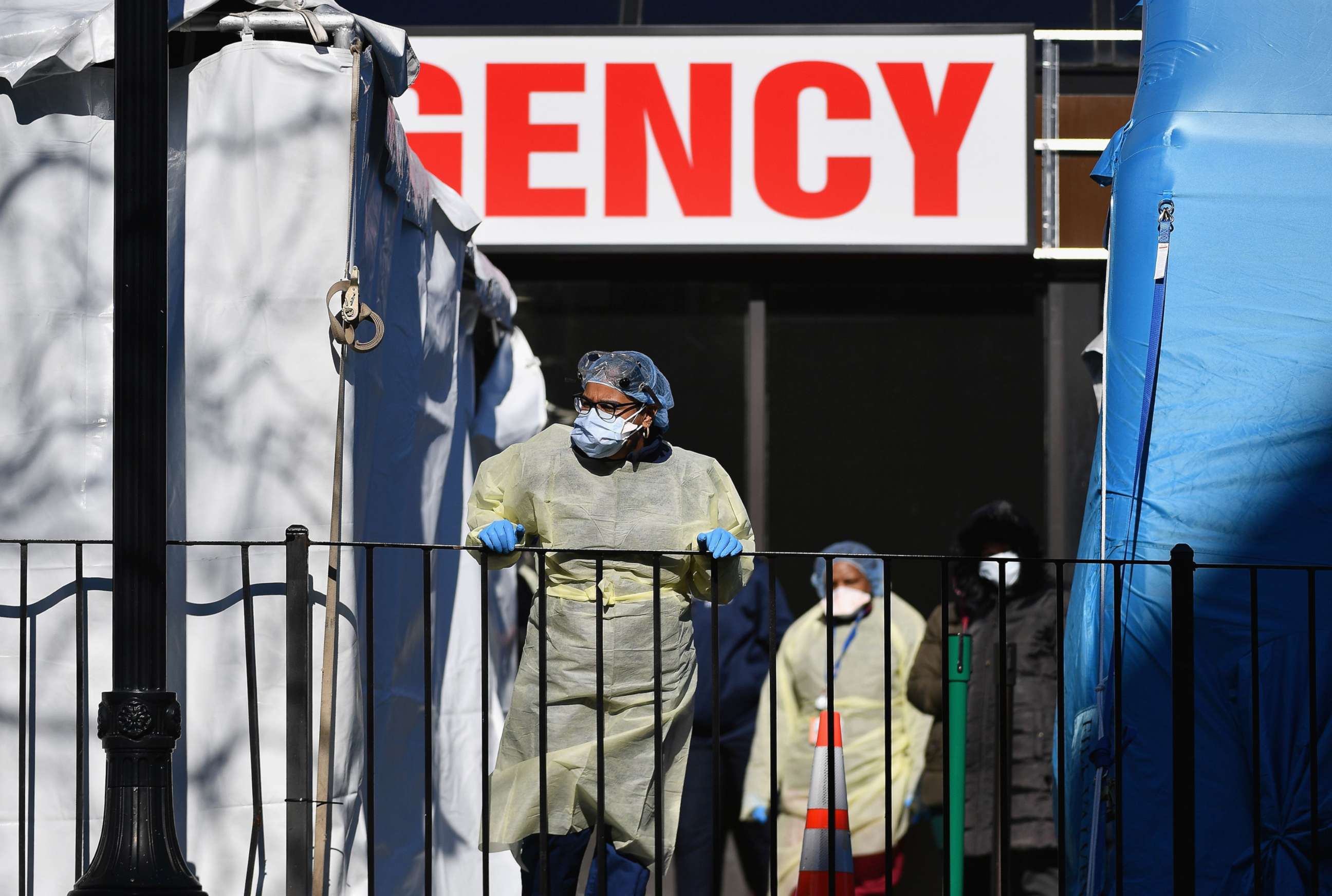 PHOTO: Medical workers outside Elmhurst Hospital Center, in the Queens borough of New York City, on March 26, 2020. The hospital reported 13 COVID-19 patients died in a 24-hour span.