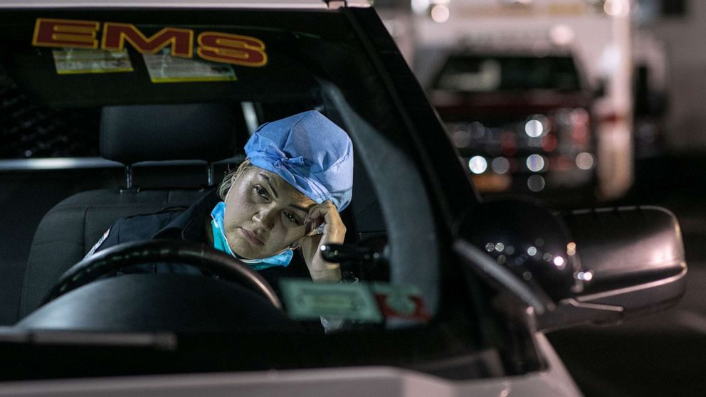 PHOTO: Paramedic Patricia Rodriguez fills out reports on a laptop after her 12-hour shift, on April 06, 2020, in Yonkers, New York