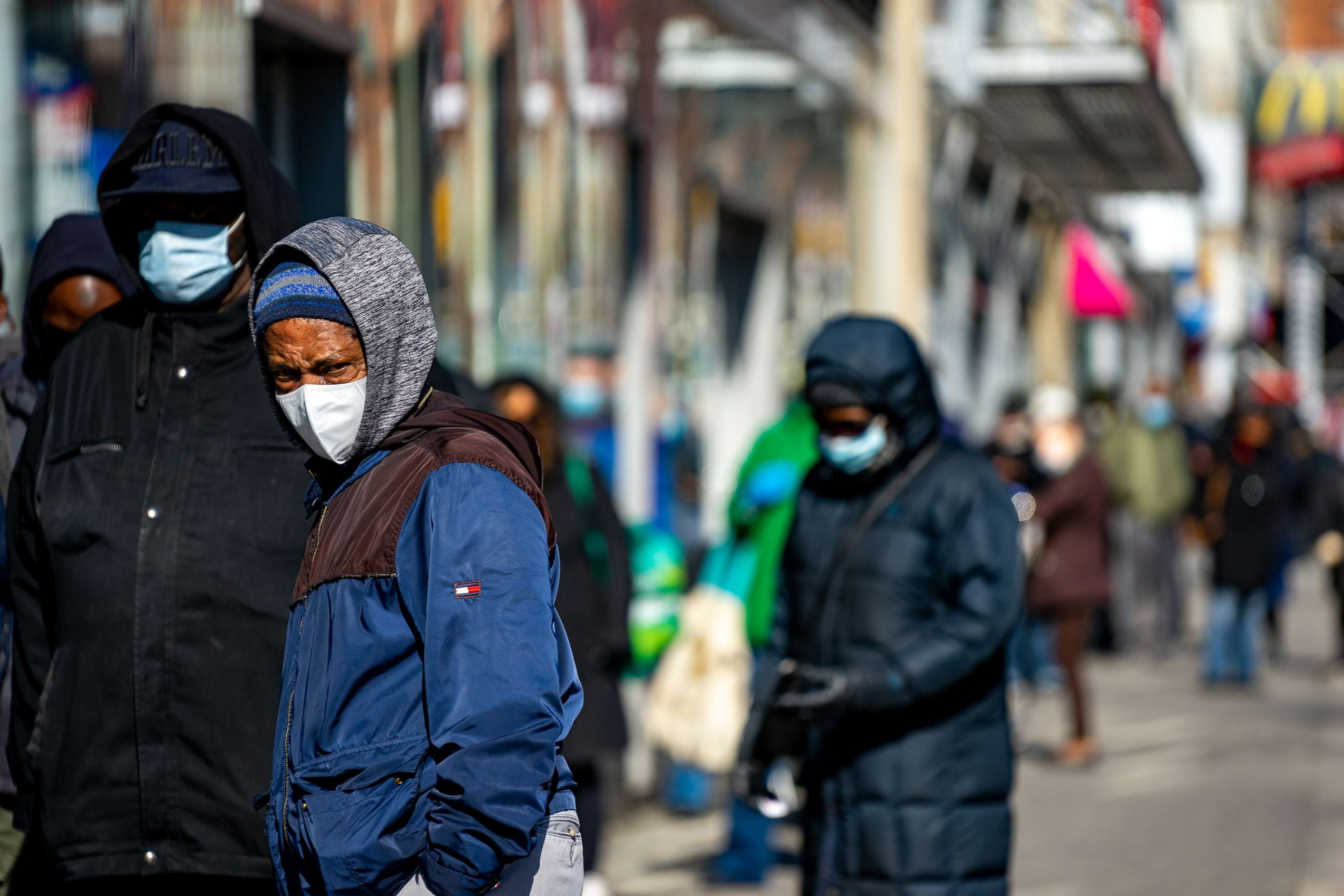 PHOTO: People wait on line outside of TD Bank, on April 16, 2020, in the Harlem neighborhood of New York City.