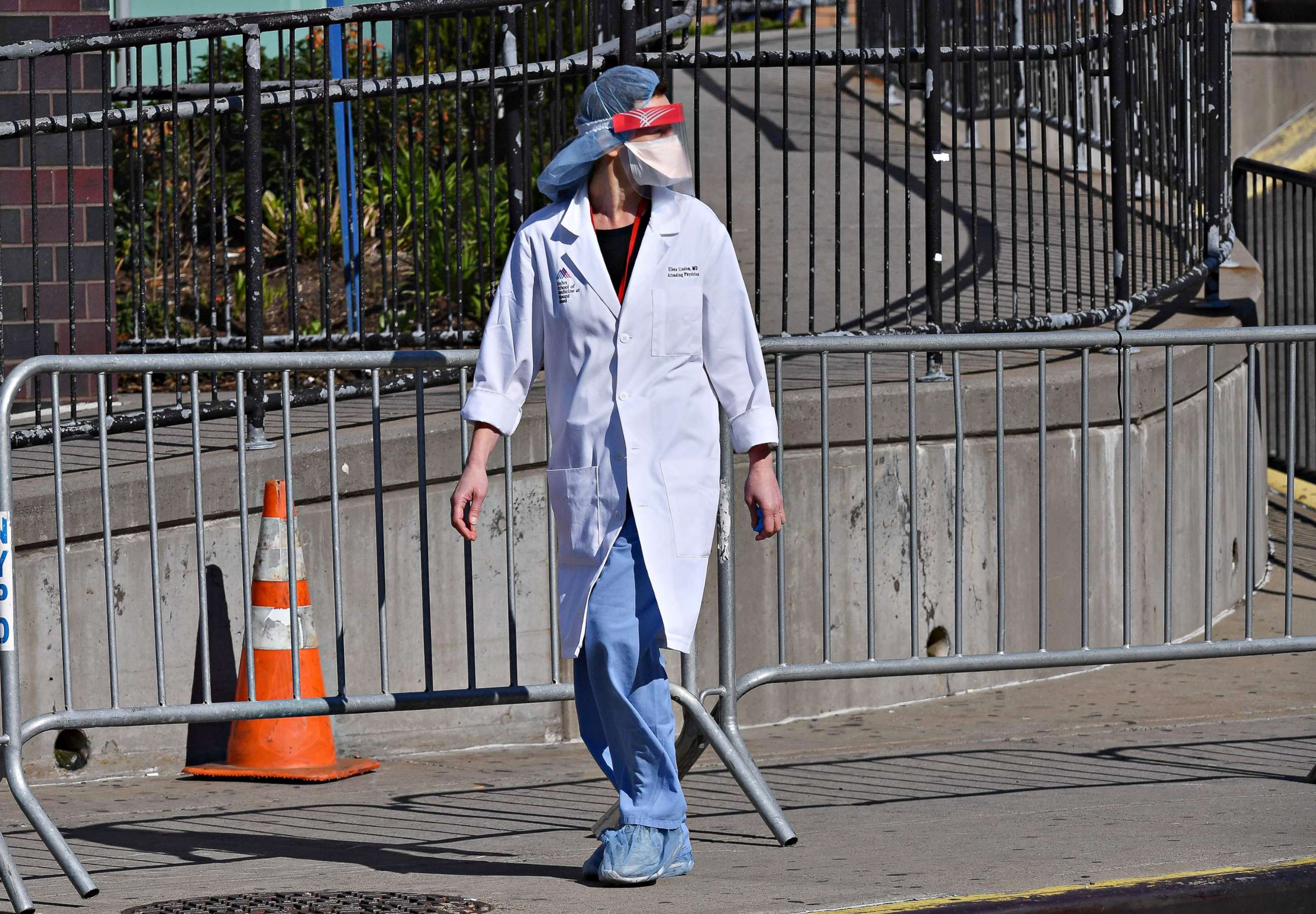 PHOTO: A physician is seen outside Elmhurst Hospital Center, in the Queens borough of New York City, on March 26, 2020.