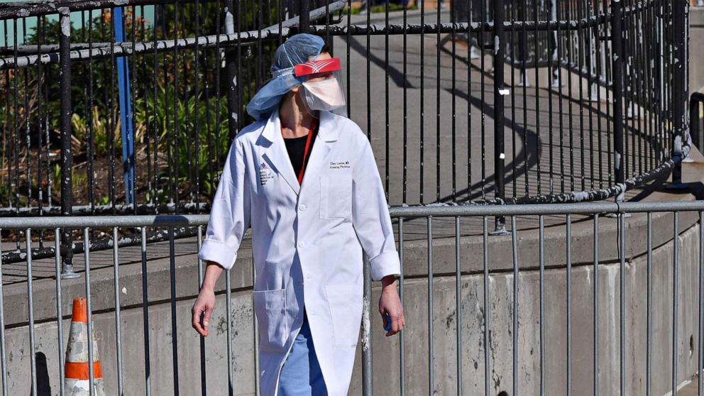 PHOTO: A physician is seen outside Elmhurst Hospital Center, in the Queens borough of New York City, on March 26, 2020.