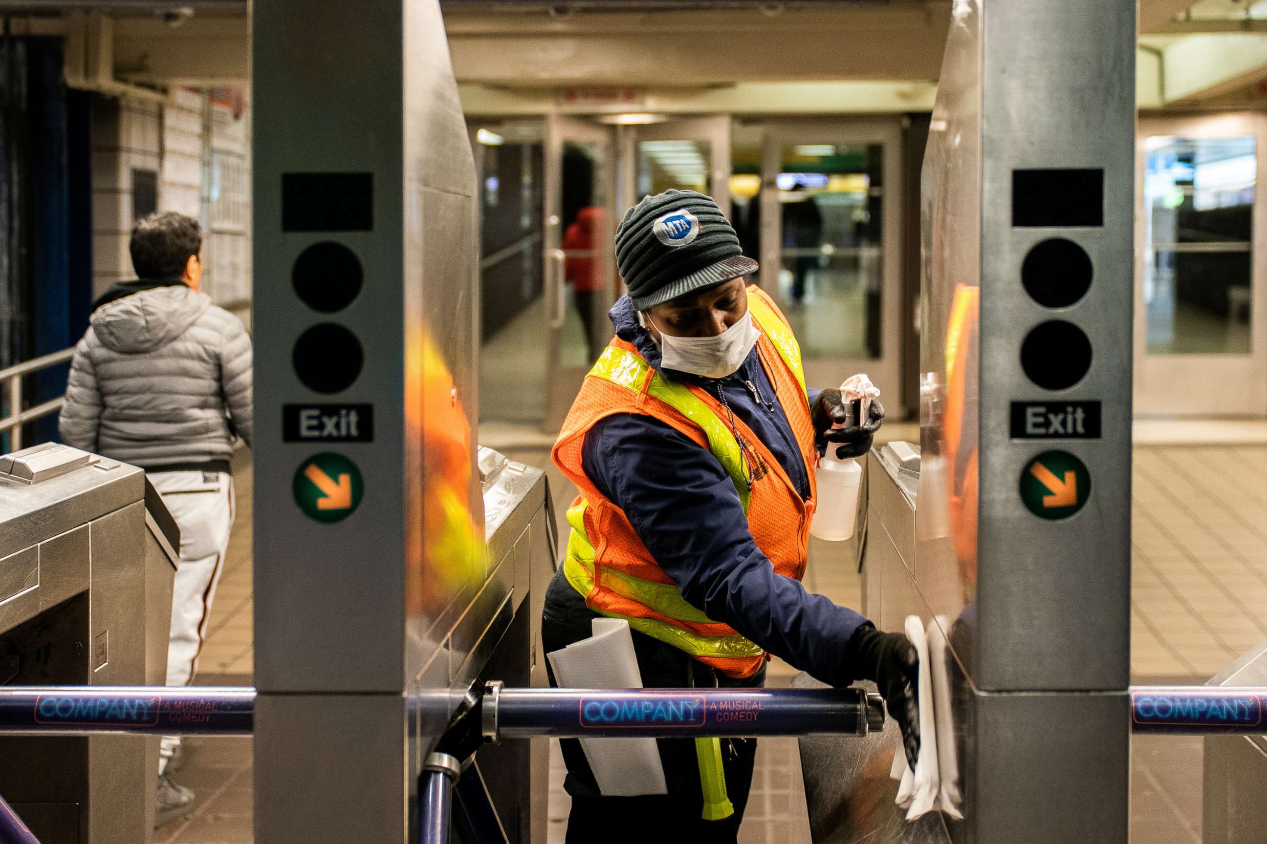 PHOTO: An MTA transit worker cleans a nearly empty Times Square - 42nd street subway station following the outbreak of the coronavirus, in New York City, March 16, 2020.