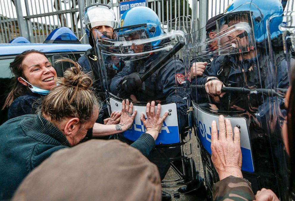 PHOTO: Relatives of inmates in Rebibbia prison confront police after inmates staged a protest against new coronavirus containment measures, in Rome, March 9, 2020.