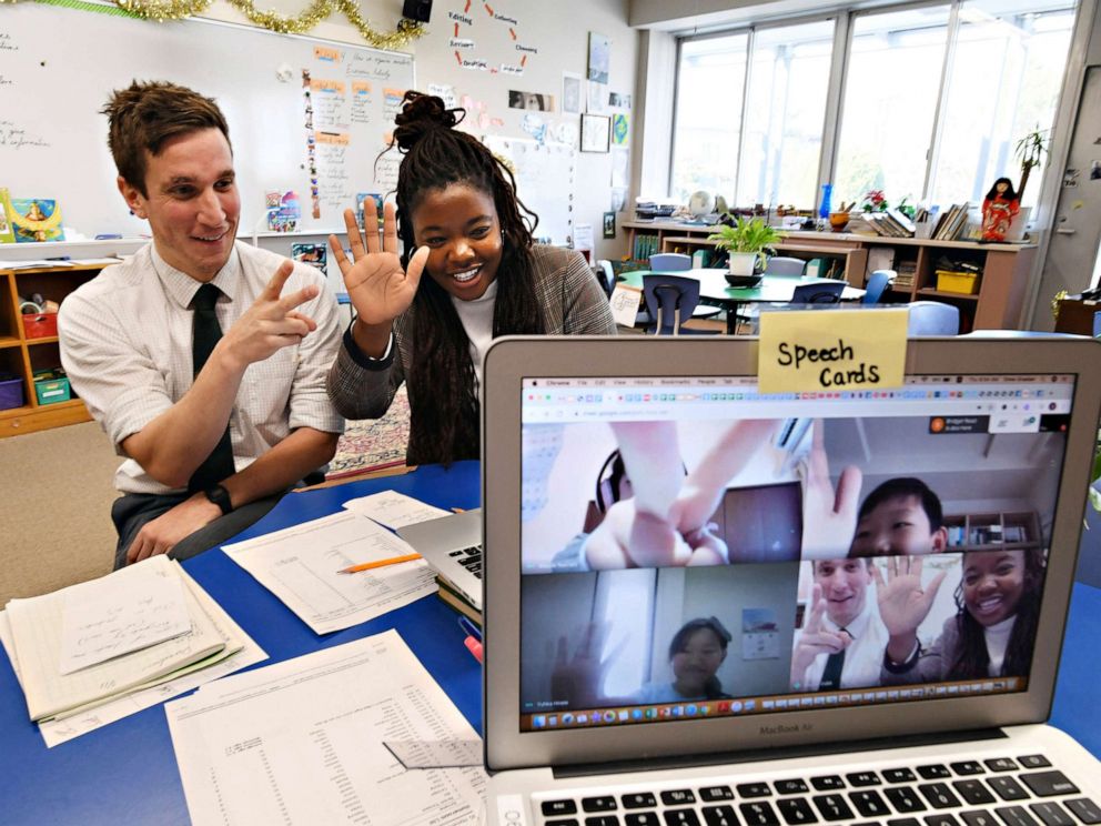 PHOTO: Teachers talk with students who are at home during an online class at Nagoya International School in Nagoya City, Aichi Prefecture, in Japan on March 5, 2020.