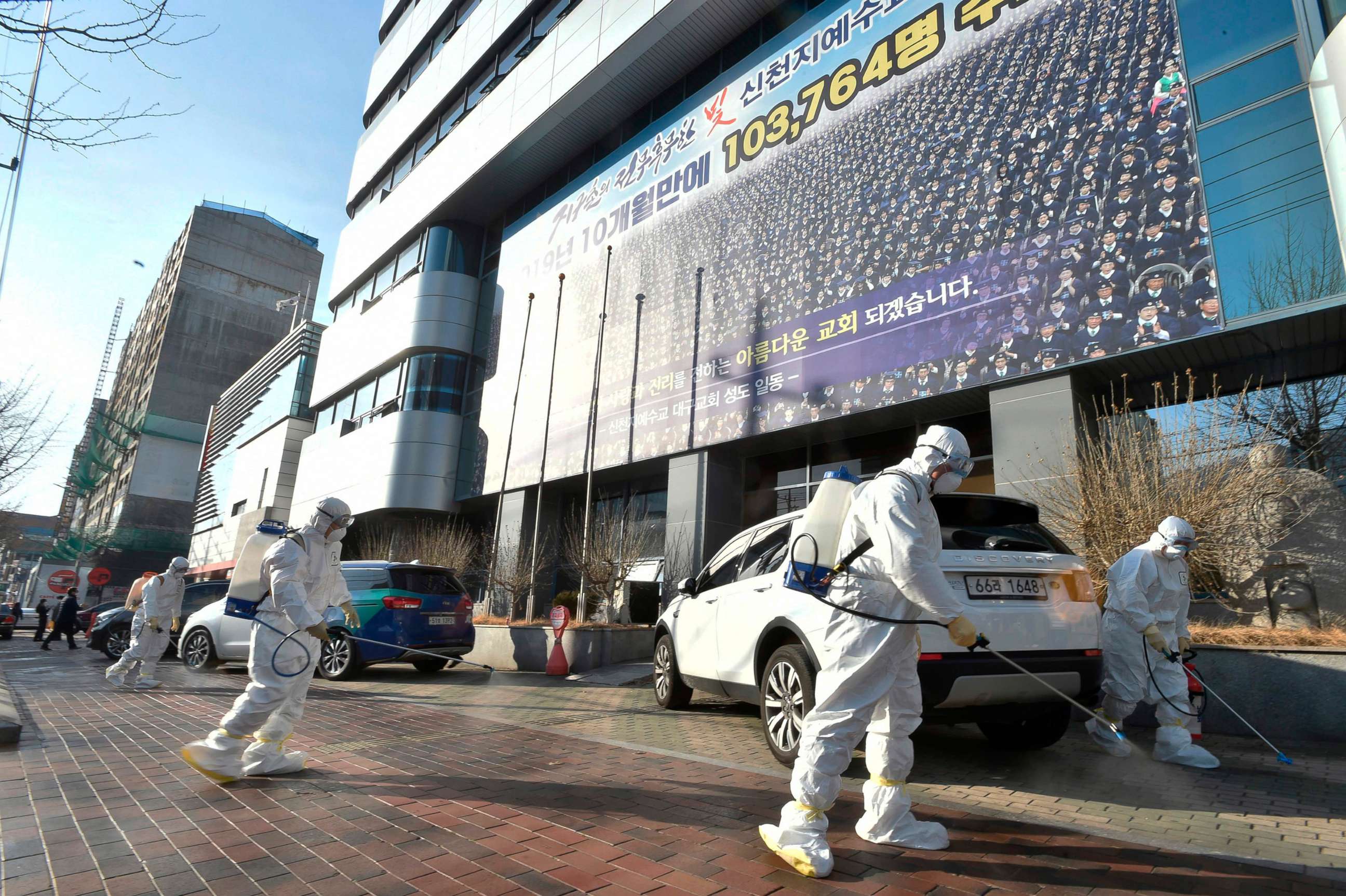 PHOTO: This picture taken on February 19, 2020 shows South Korean health officials spray disinfectant near Shincheonji Church of Jesus in the southeastern city of Daegu on Feb. 19, 2020, after a number of churchgoers were identified as having COVID-19.