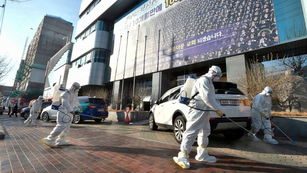 PHOTO: This picture taken on February 19, 2020 shows South Korean health officials spray disinfectant near Shincheonji Church of Jesus in the southeastern city of Daegu on Feb. 19, 2020, after a number of churchgoers were identified as having COVID-19.
