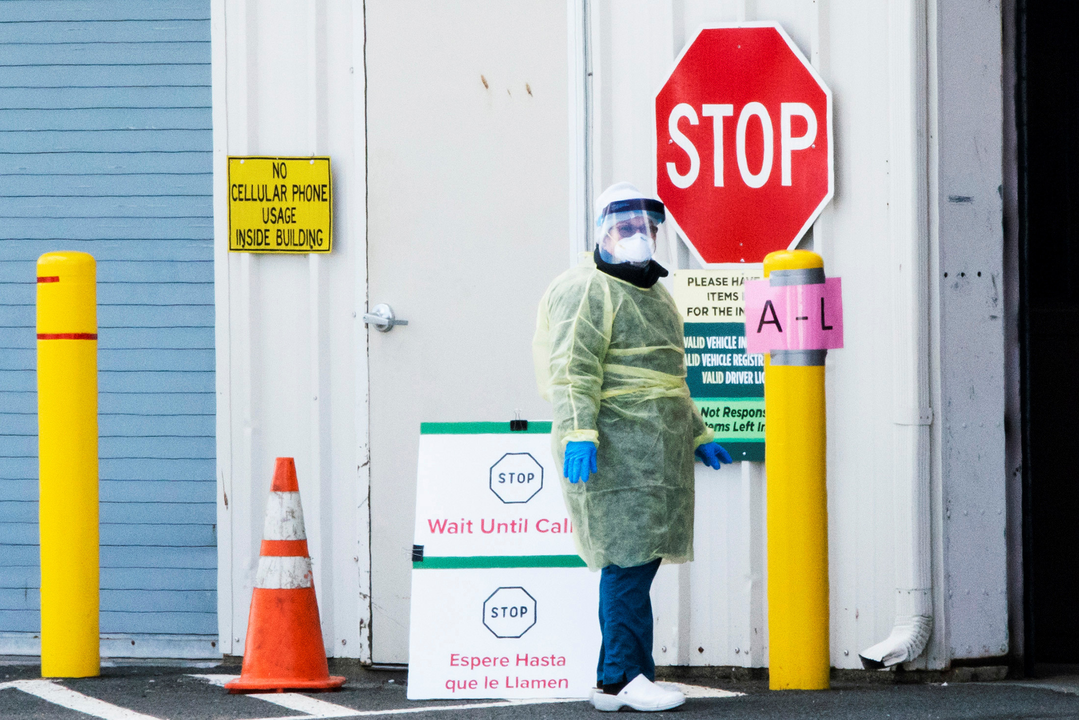 PHOTO: A health worker waits to test people in cars as they use a newly approved saliva-based COVID-19 test at a testing site during the the coronavirus pandemic, in Edison, New Jersey, April 15, 2020.
