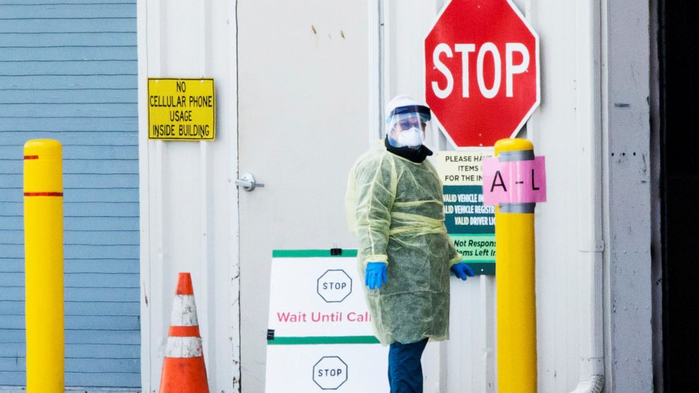 PHOTO: A health worker waits to test people in cars as they use a newly approved saliva-based COVID-19 test at a testing site during the the coronavirus pandemic, in Edison, New Jersey, April 15, 2020.