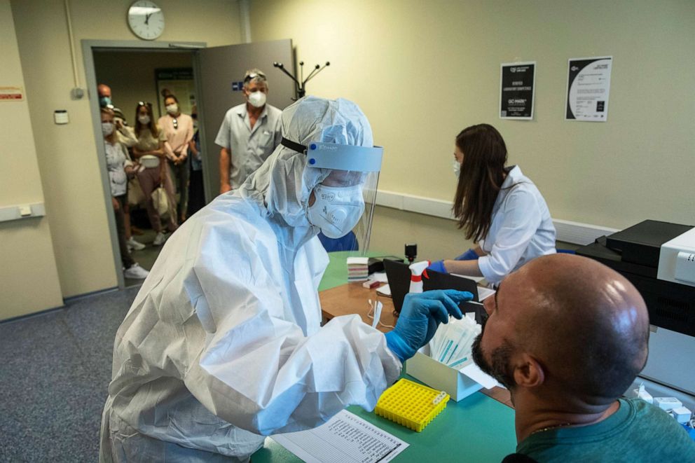 PHOTO: A medical worker performs a COVID-19 test at a test center at Vnukovo International Airport outside Moscow, Russia, on Aug. 7, 2020.