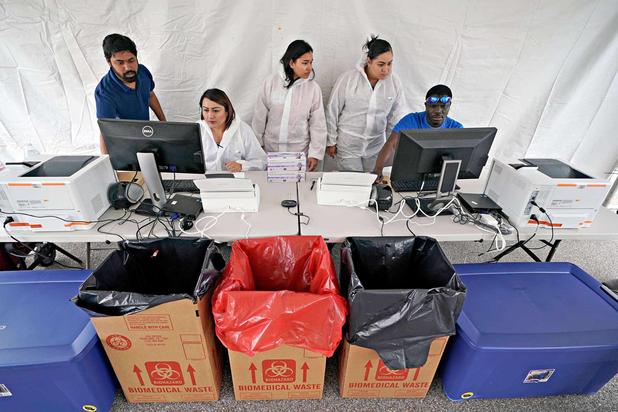 PHOTO: Medical professionals prepare to open a new drive through free Covid-19 testing site provided by United Memorial Medical Center, April 2, 2020, in Houston.