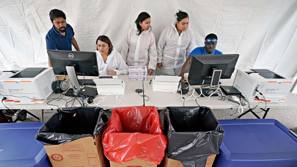 PHOTO: Medical professionals prepare to open a new drive through free Covid-19 testing site provided by United Memorial Medical Center, April 2, 2020, in Houston.