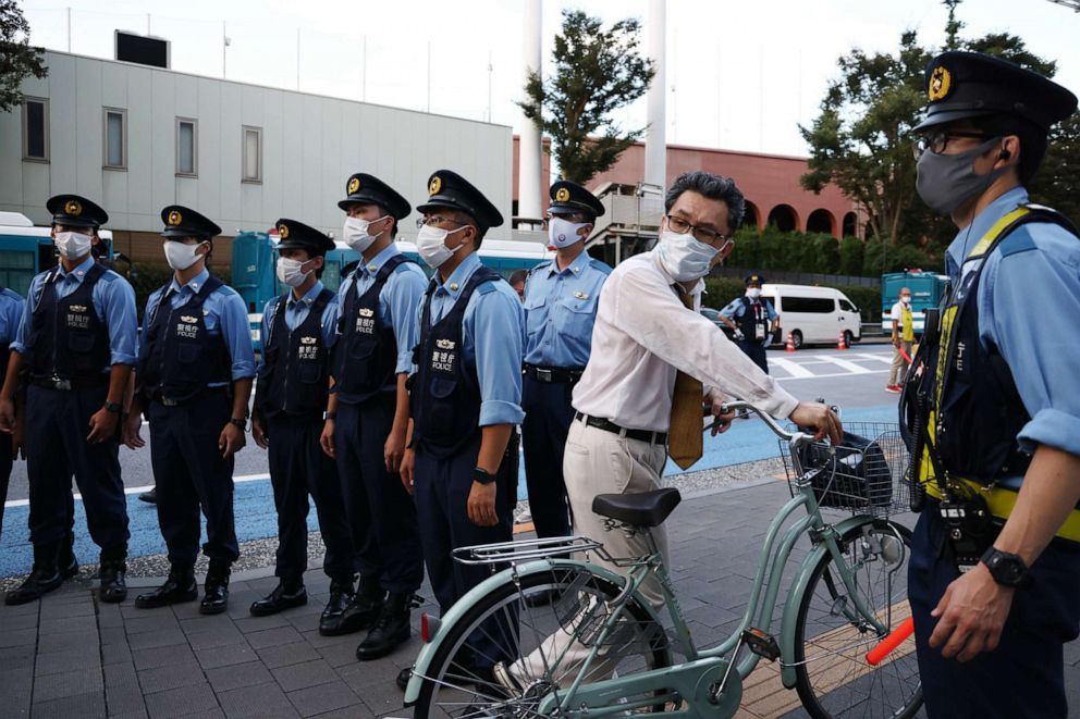 PHOTO: Police officers guard the area outside Olympic Stadium during a protest against the 2020 Summer Olympics on Aug. 5, 2021, in Tokyo, Japan.