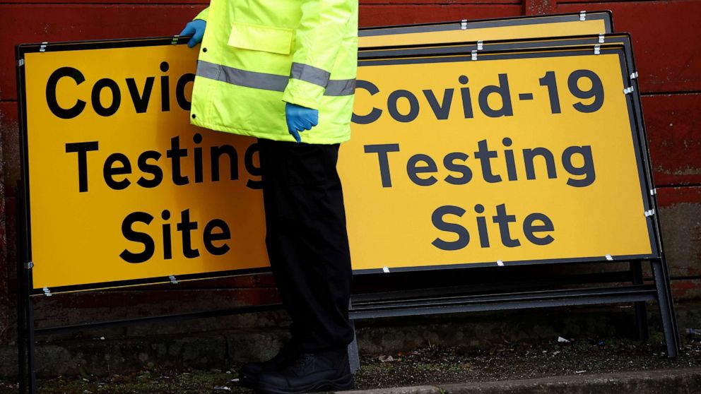 PHOTO: A member of NHS Test and Trace staff sets up a mobile testing centre amid the outbreak COVID-19 in Manchester, Britain, Feb. 17, 2021. 