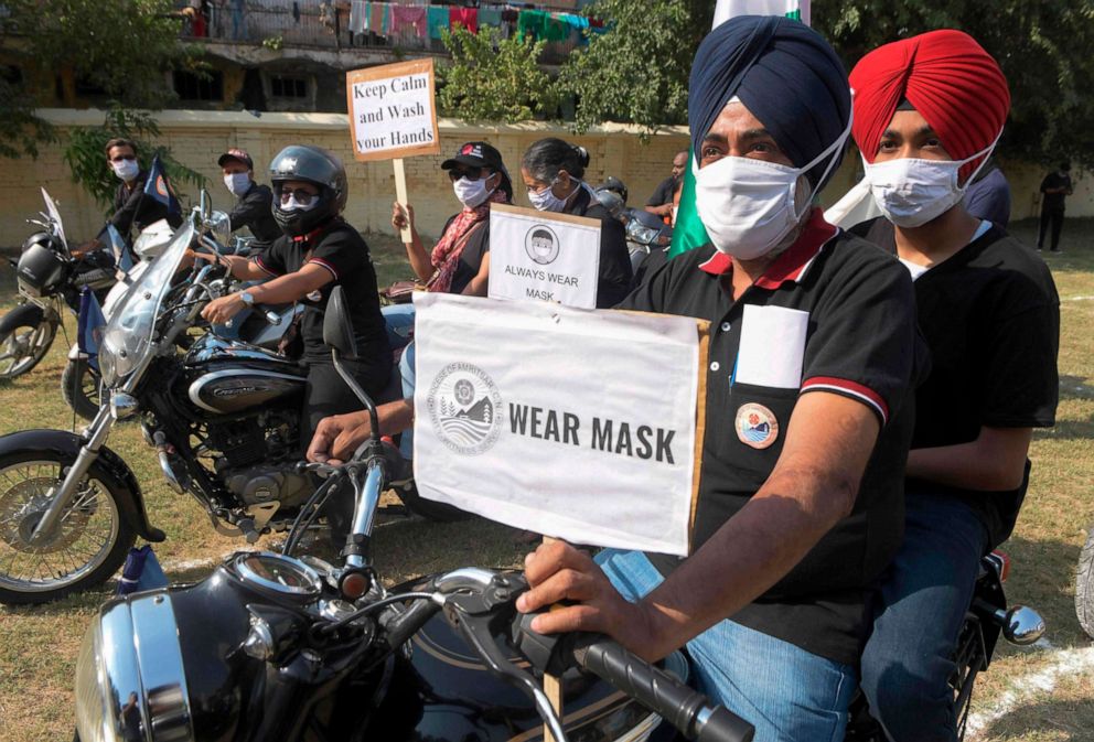 PHOTO: Motorcyclists ride on their motobikes during a "Fight COVID-19 Awareness Building Motorcycle Rally" in Amritsar, northwestern India, on Oct. 20, 2020.