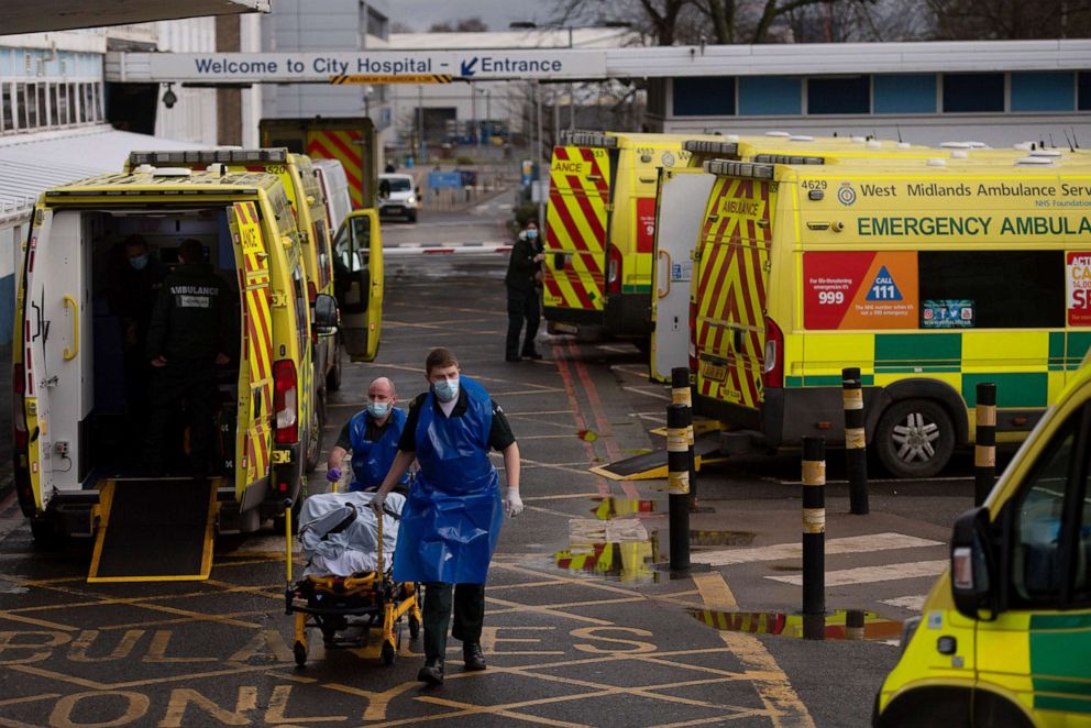 PHOTO: Ambulance crews transport a patients into City Hospital in Birmingham, England, Jan. 12, 2021. Birmingham is one of several areas with the highest-growing coronavirus numbers.
