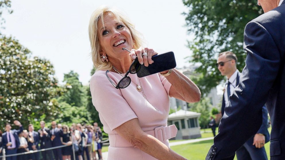 PHOTO: First lady Jill Biden walks with U.S. President Joe Biden towards Marine One before departing the White House for a weekend in Rehoboth, Del., at the White House, June 17, 2022.