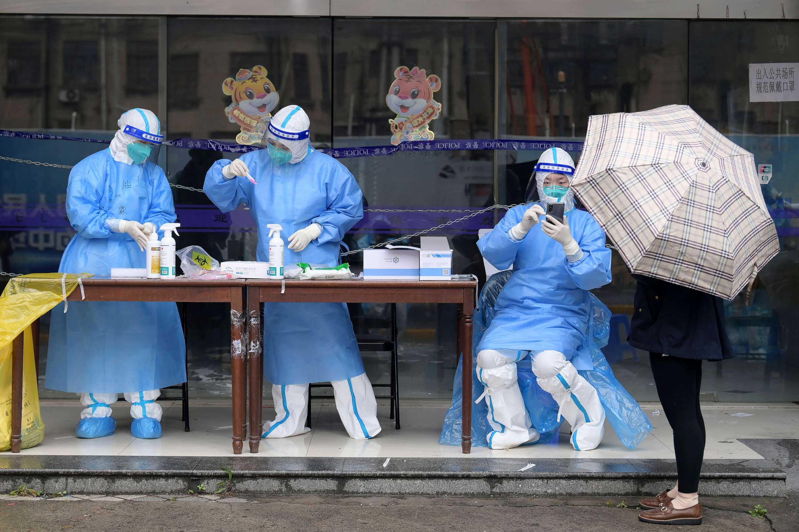 PHOTO: In this photo released by Xinhua News Agency, workers prepare to conduct nucleic acid test for citizens in Huangpu District in Shanghai, China, April 26, 2022.