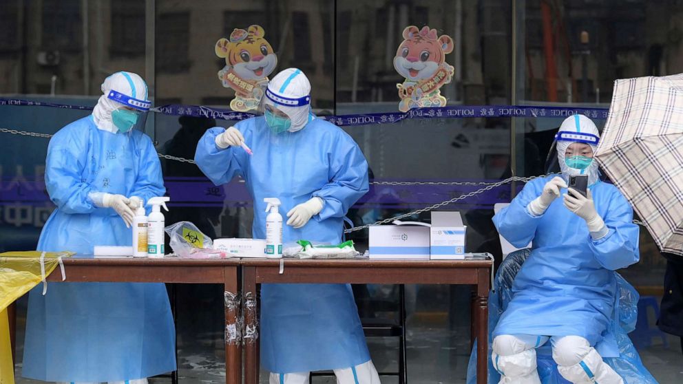 PHOTO: In this photo released by Xinhua News Agency, workers prepare to conduct nucleic acid test for citizens in Huangpu District in Shanghai, China, April 26, 2022.