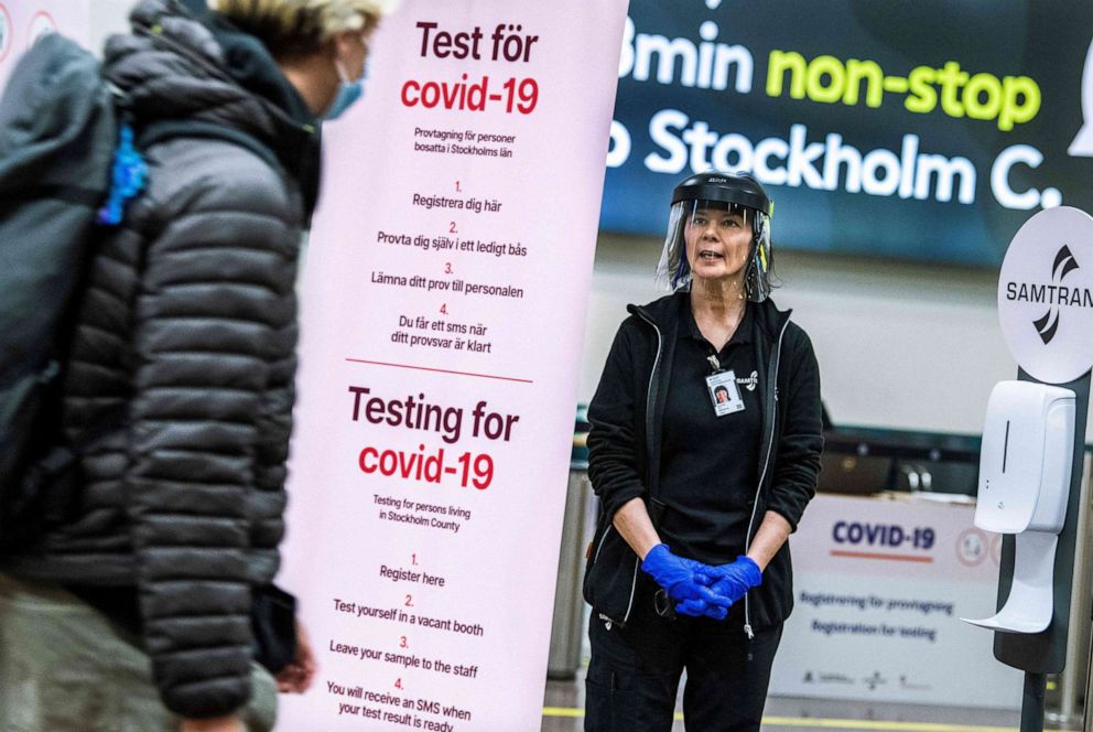 PHOTO: Asa Wernsten works at the sampling station for the COVID-19 test at Stockholm's Arlanda Airport, for travellers who arrive with international flights on Feb. 22, 2021.
