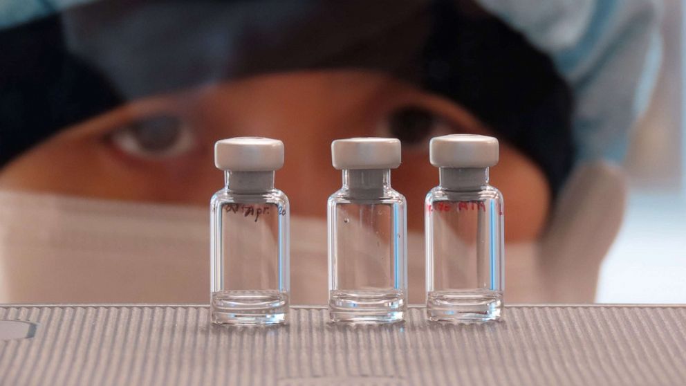 PHOTO: A scientist checks quality control of vaccine vials for correct volume at the Clinical Biomanufacturing Facility (CBF) in Oxford, Britain, April 2, 2020.