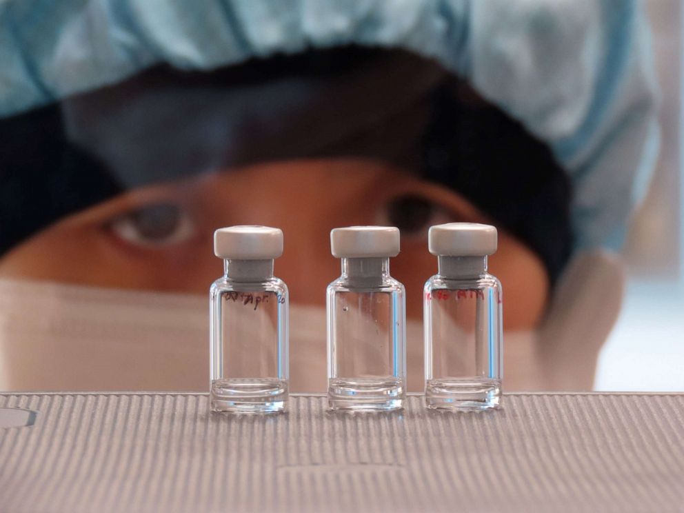 PHOTO: A scientist checks quality control of vaccine vials for correct volume at the Clinical Biomanufacturing Facility (CBF) in Oxford, Britain, April 2, 2020.