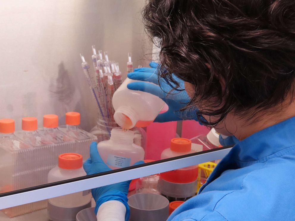 PHOTO: A scientist working on the team developing the ChAdOx1 vaccine candidate against COVID-19 pours fluids at the Clinical Biomanufacturing Facility (CBF) in Oxford, Britain, March 15, 2020