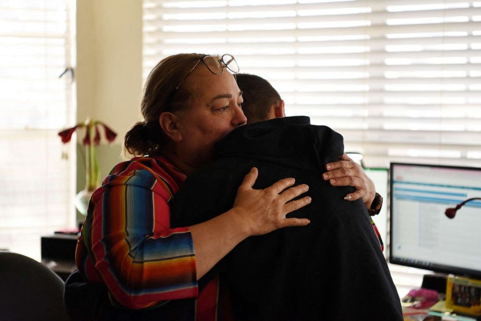 PHOTO: Margaret Garza hugs her son Julius Garza, 14, in Converse, Texas, March 22, 2022.