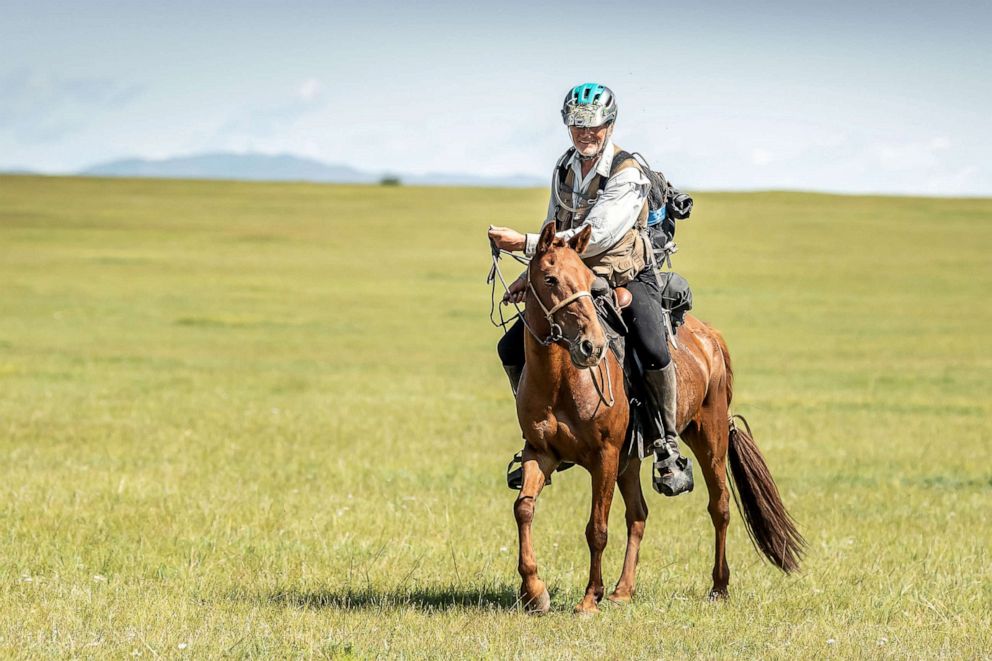 PHOTO: Robert Long, known by the nickname Cowboy Bob, who is the oldest winner of Mongol Derby, the 1,000 km world's longest horse race, sits on his horse near Jargalt, Mongolia, Aug. 14, 2019.