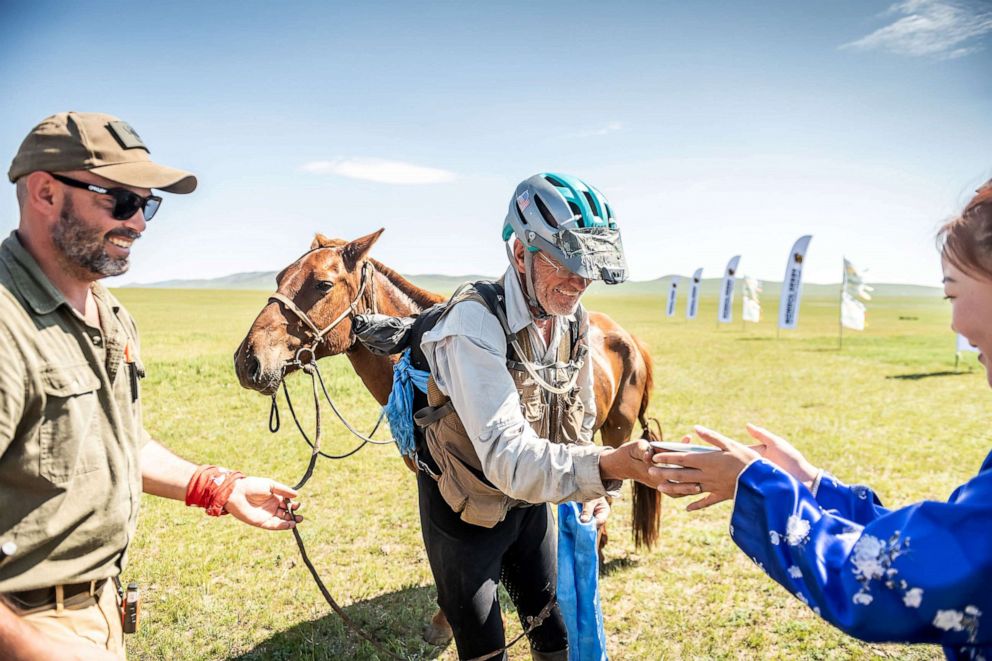 PHOTO: Robert Long, known by the nickname Cowboy Bob, who is the oldest winner of Mongol Derby, the 1,000 km world's longest horse race, is pictured with his horse near Jargalt, Mongolia, Aug. 14, 2019.