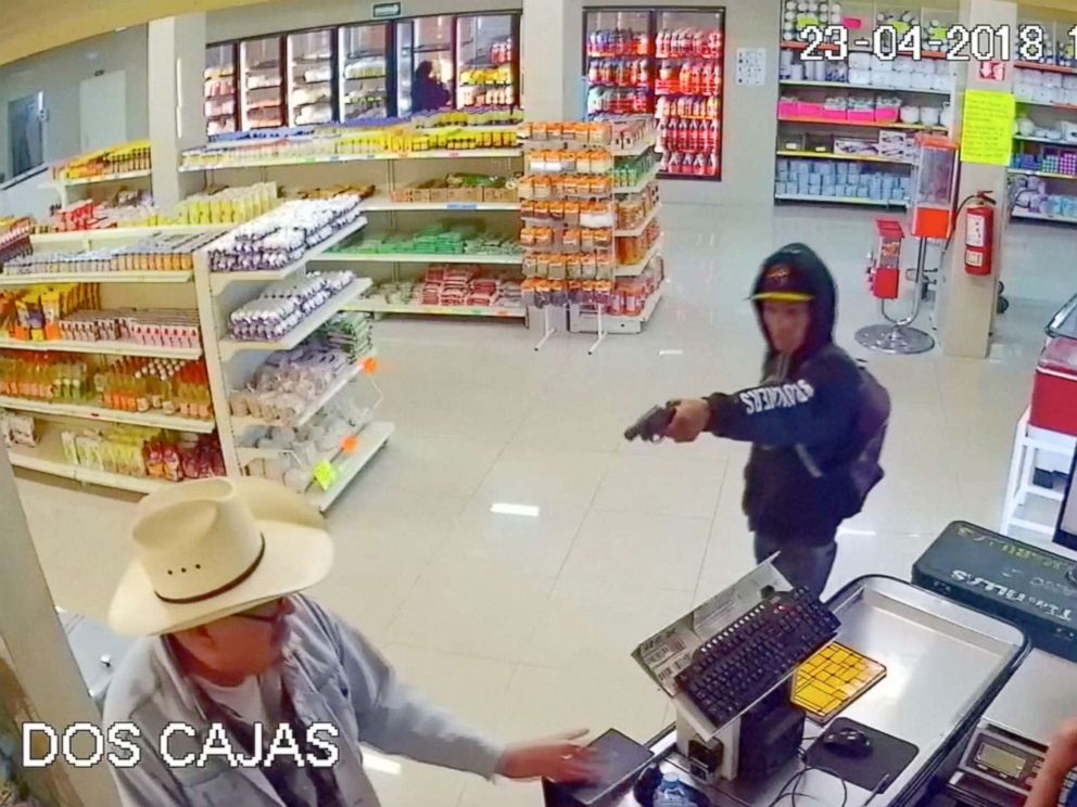 PHOTO: Man wearing cowboy hat tackles armed robber at butcher shop in Mexico.