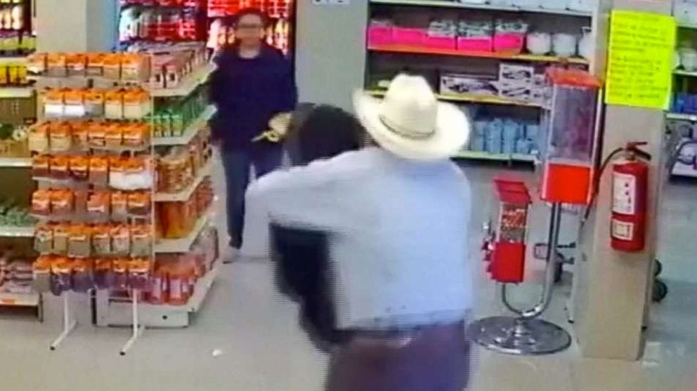 PHOTO: Good Samaritan wearing cowboy hat tackles armed robber at butcher shop in Mexico.