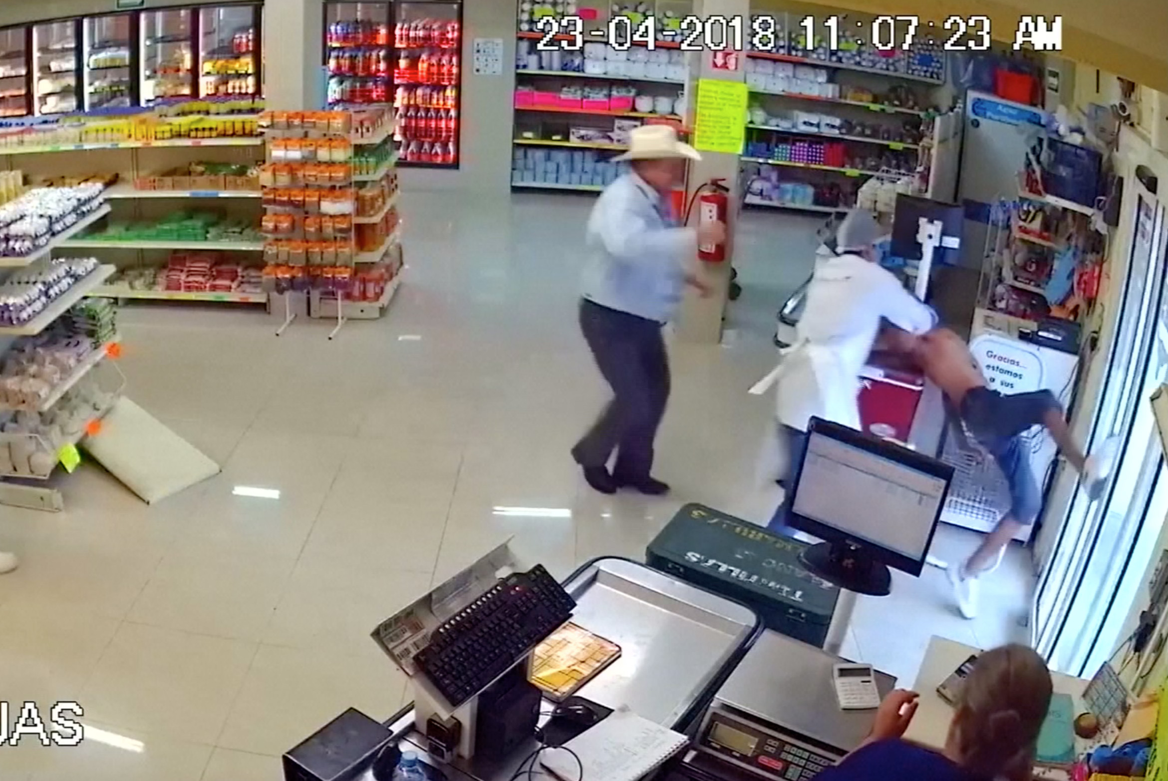 PHOTO: Man wearing cowboy hat tackles would-be armed robber at store in Mexico.