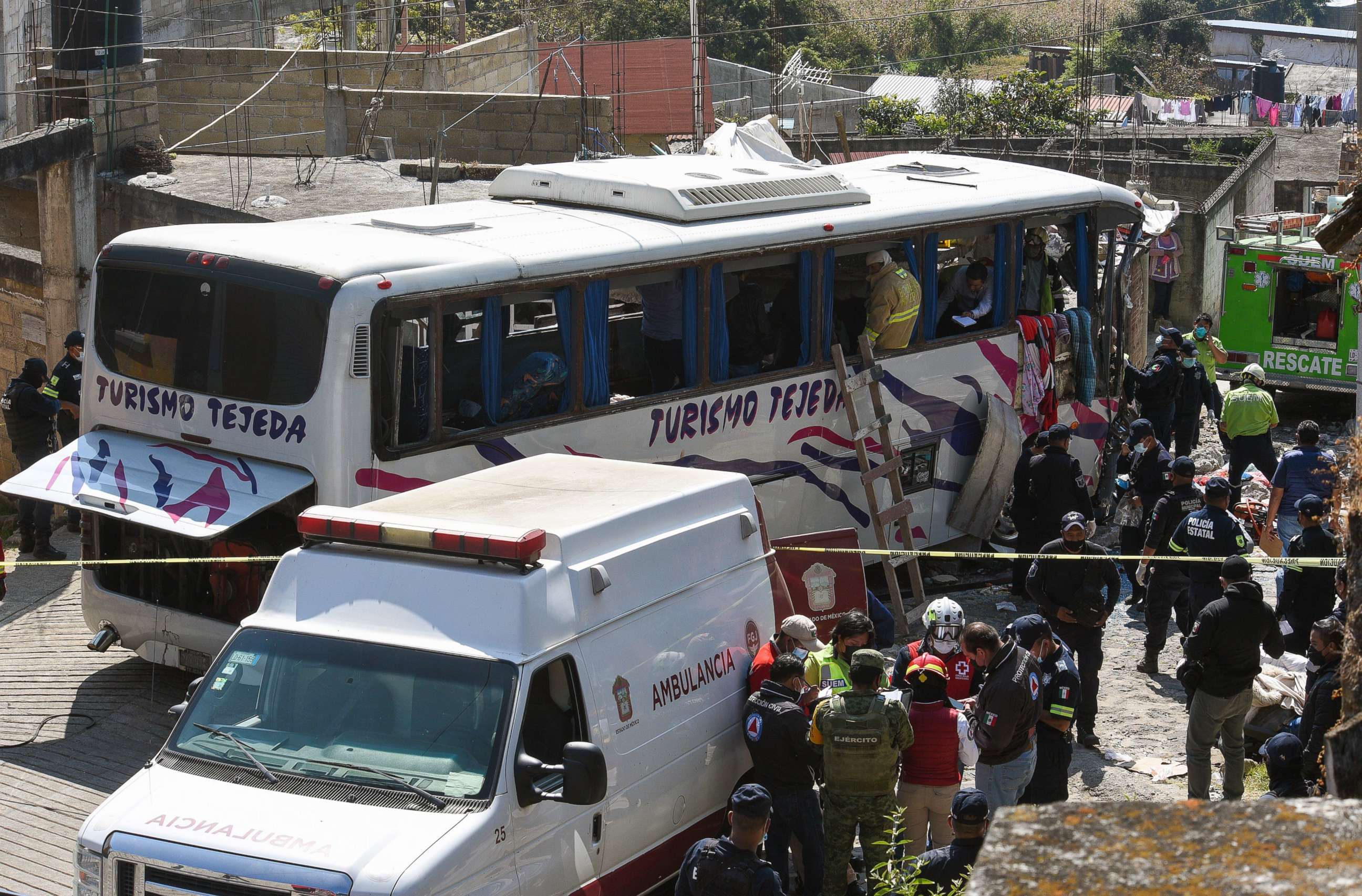 PHOTO: Rescuers and authorities in the area of the accident in Joquicingo, near Mexico City, Nov. 26, 2021.