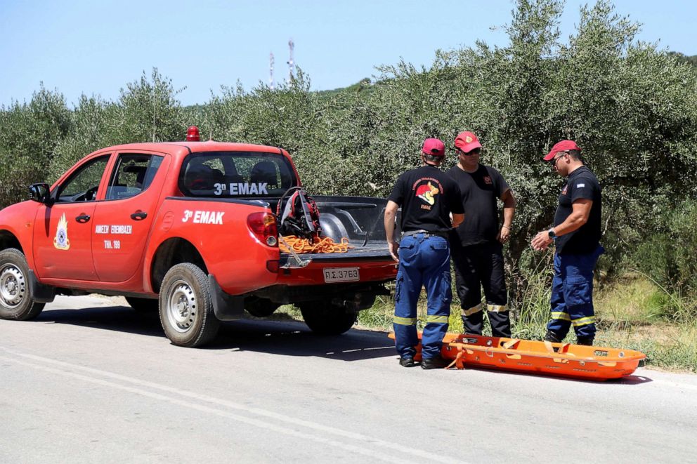 PHOTO: Members of a search and rescue team of the fire brigade prepare to retrieve the body of a woman found near the village of Kolimpari on the island of Crete, Greece, July 9, 2019.