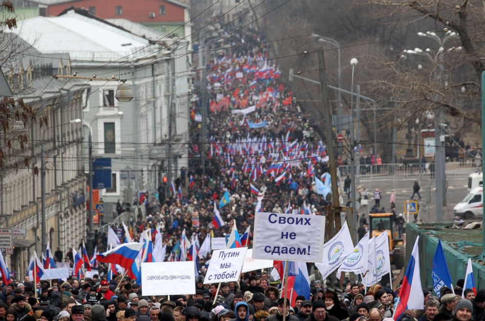 PHOTO: People attend a rally to support Russian President Vladimir Putin with the invasion of Crimea, March 2, 2014, in Moscow.