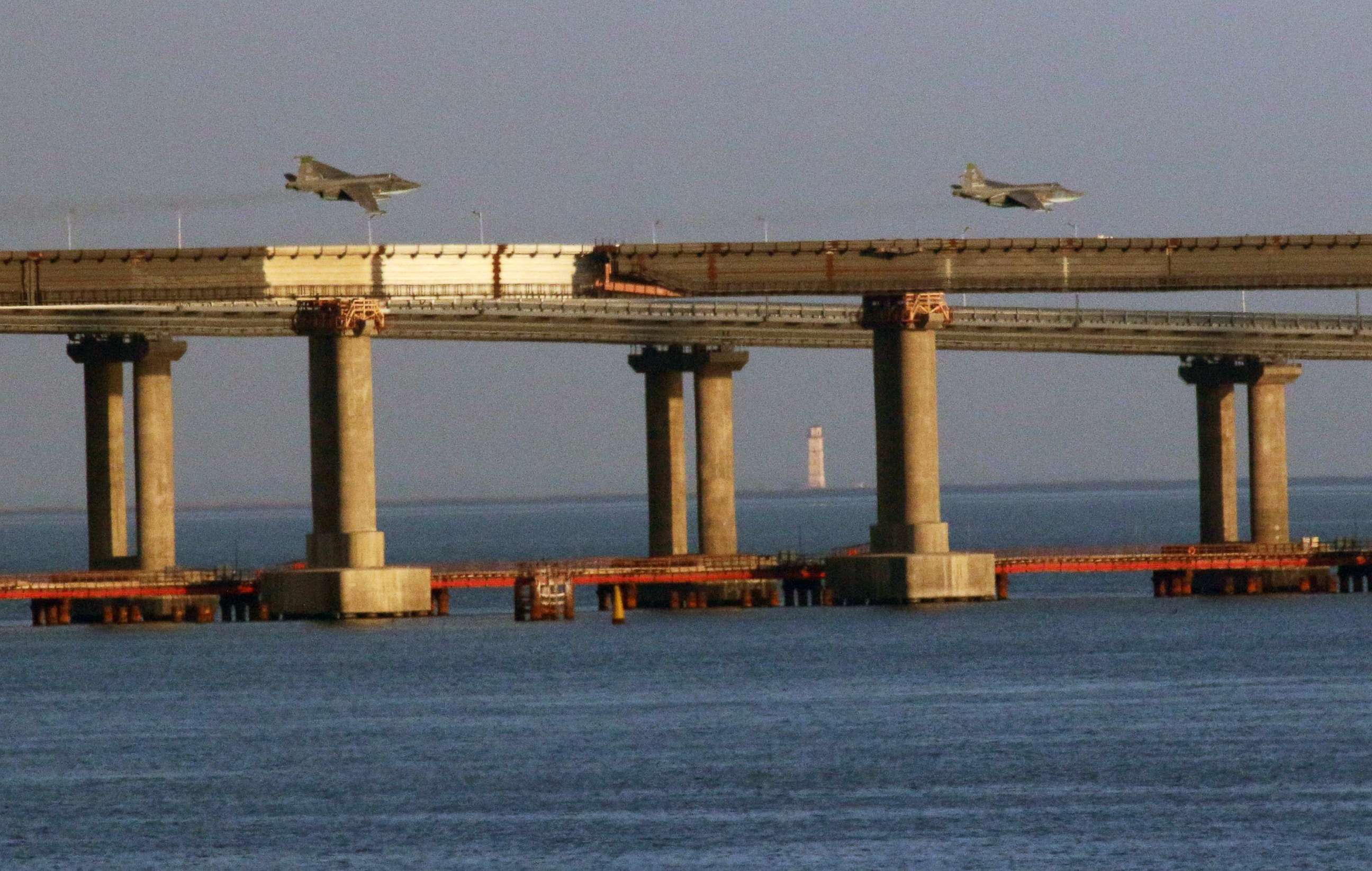 PHOTO: Russian jet fighters fly over a bridge connecting the Russian mainland with the Crimean Peninsula after three Ukrainian navy vessels were stopped by Russia from entering the Sea of Azov via the Kerch Strait in the Black Sea, Crimea, Nov. 25, 2018.