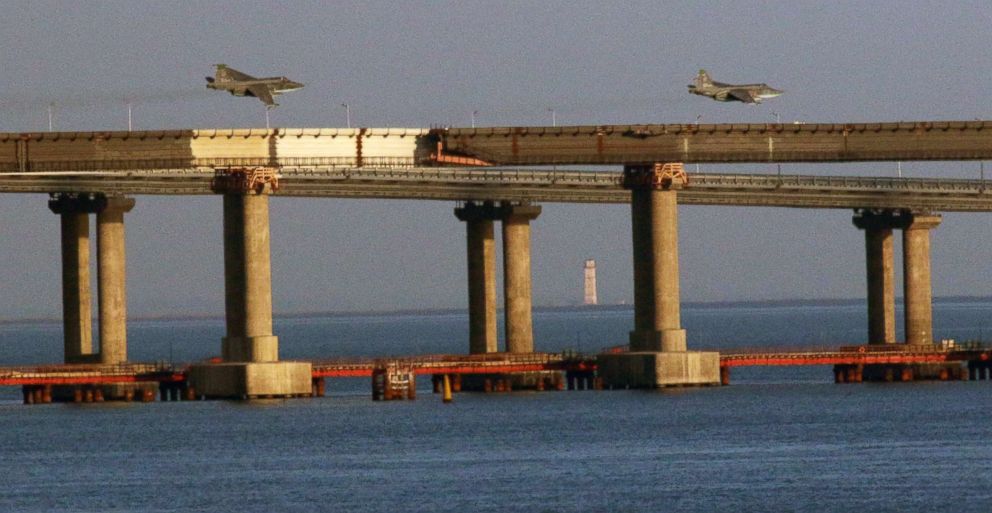 PHOTO: Russian jet fighters fly over a bridge connecting the Russian mainland with the Crimean Peninsula after three Ukrainian navy vessels were stopped by Russia from entering the Sea of Azov via the Kerch Strait in the Black Sea, Crimea, Nov. 25, 2018.