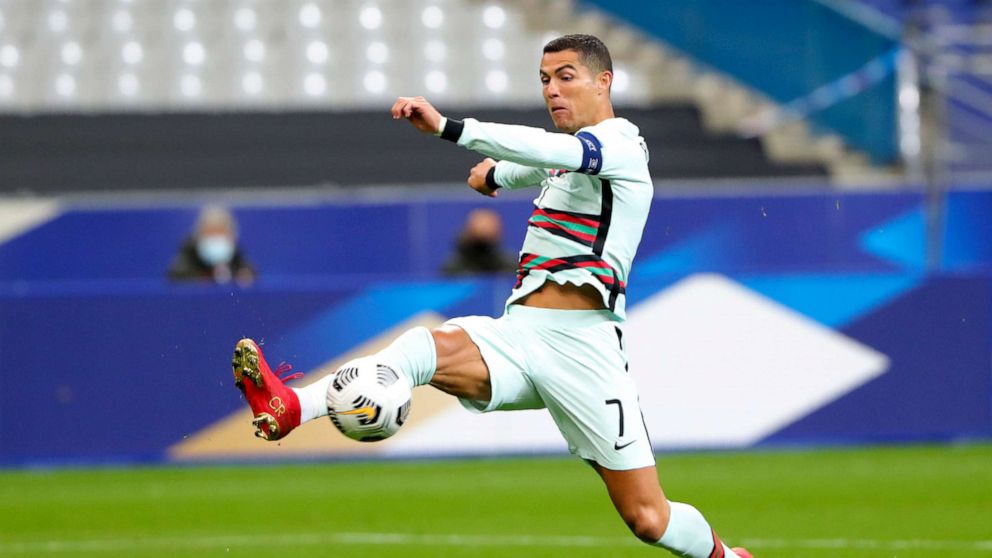 PHOTO: Portugal's Cristiano Ronaldo stretches for the ball during the UEFA Nations League soccer match between France and Portugal at the Stade de France in Saint-Denis, north of Paris, France, on Oct. 11, 2020.